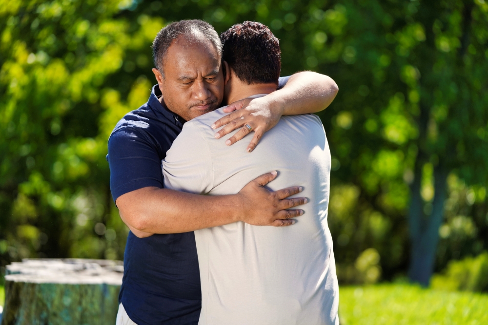 Two people embracing.